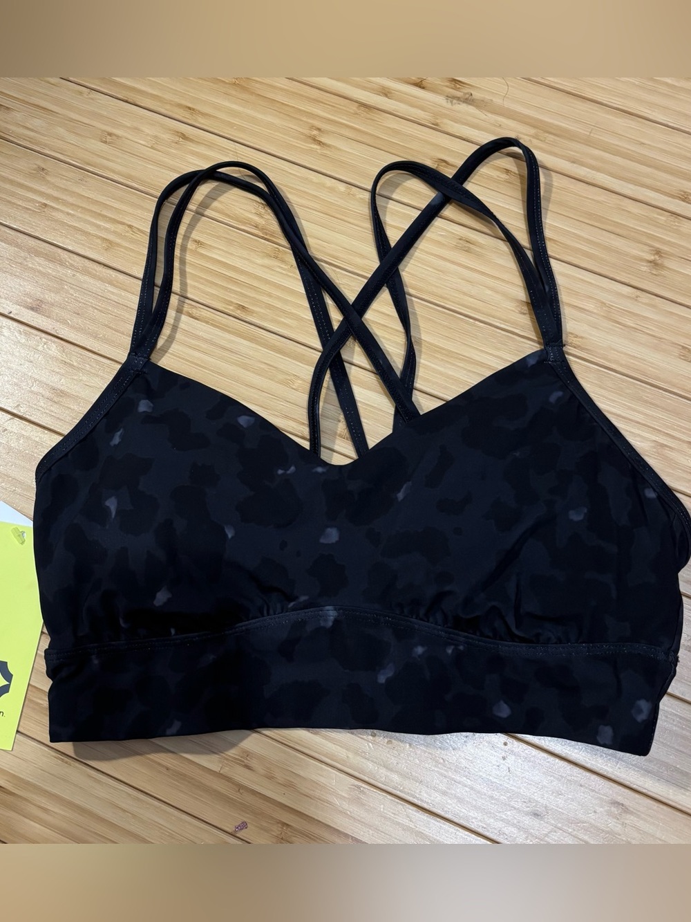 Strappy back animal print sports bra. Black and grey. Size M. NWT. Pads included